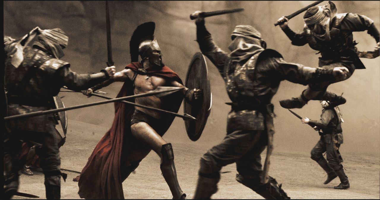 In einer engen Felsschlucht der Thermopylen versuchen die Spartaner (Vincent Regan, 2v.l.) mit einer Handvoll Verbündeter, der zahlenmäßigen Übe... - Bildquelle: TM &   Warner Bros. Entertainment Inc.